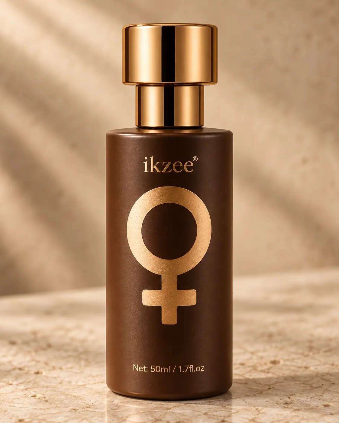 Close view of the IKZEE No.02 gold cap, symbol, and satin bottle finish